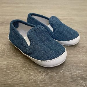 Chambray blue gender neutral slip on baby sneakers, size 12-18m.